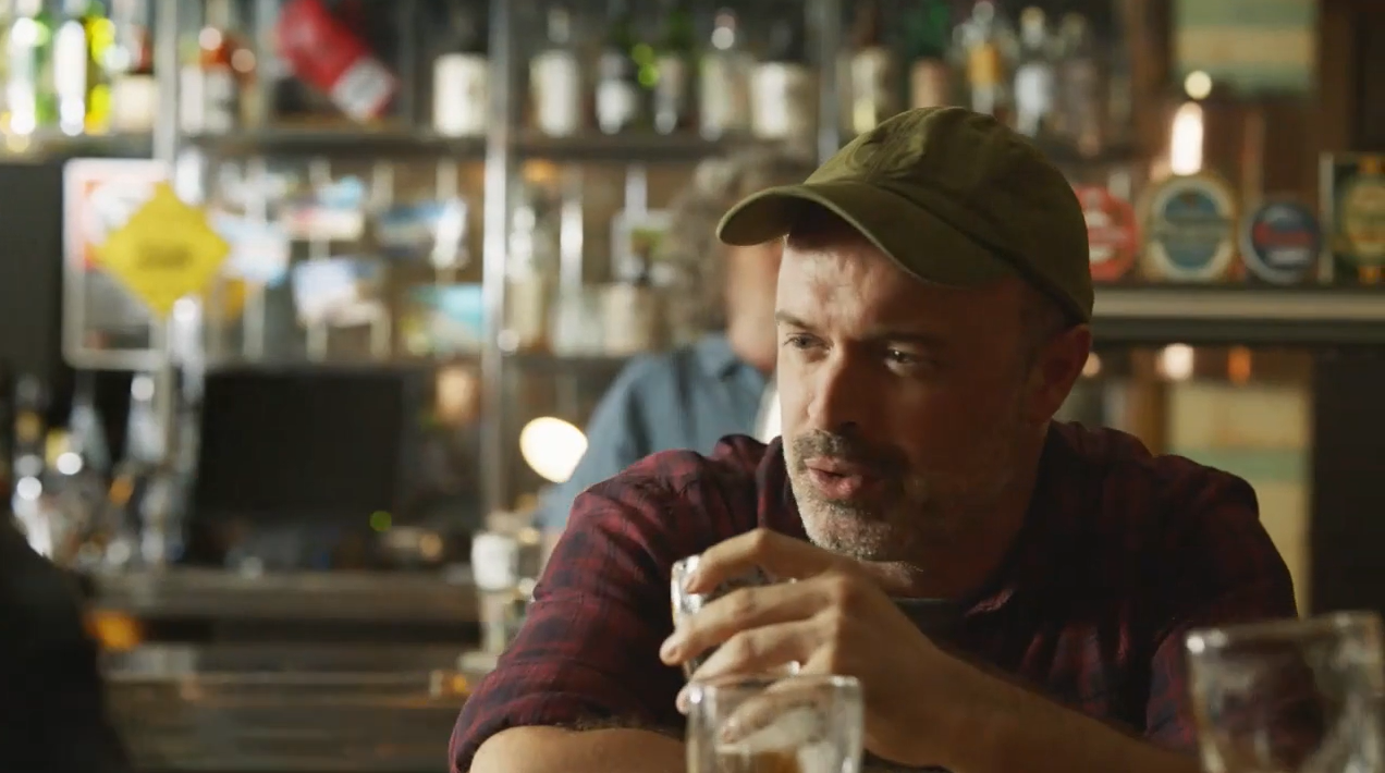 man drinking at pub