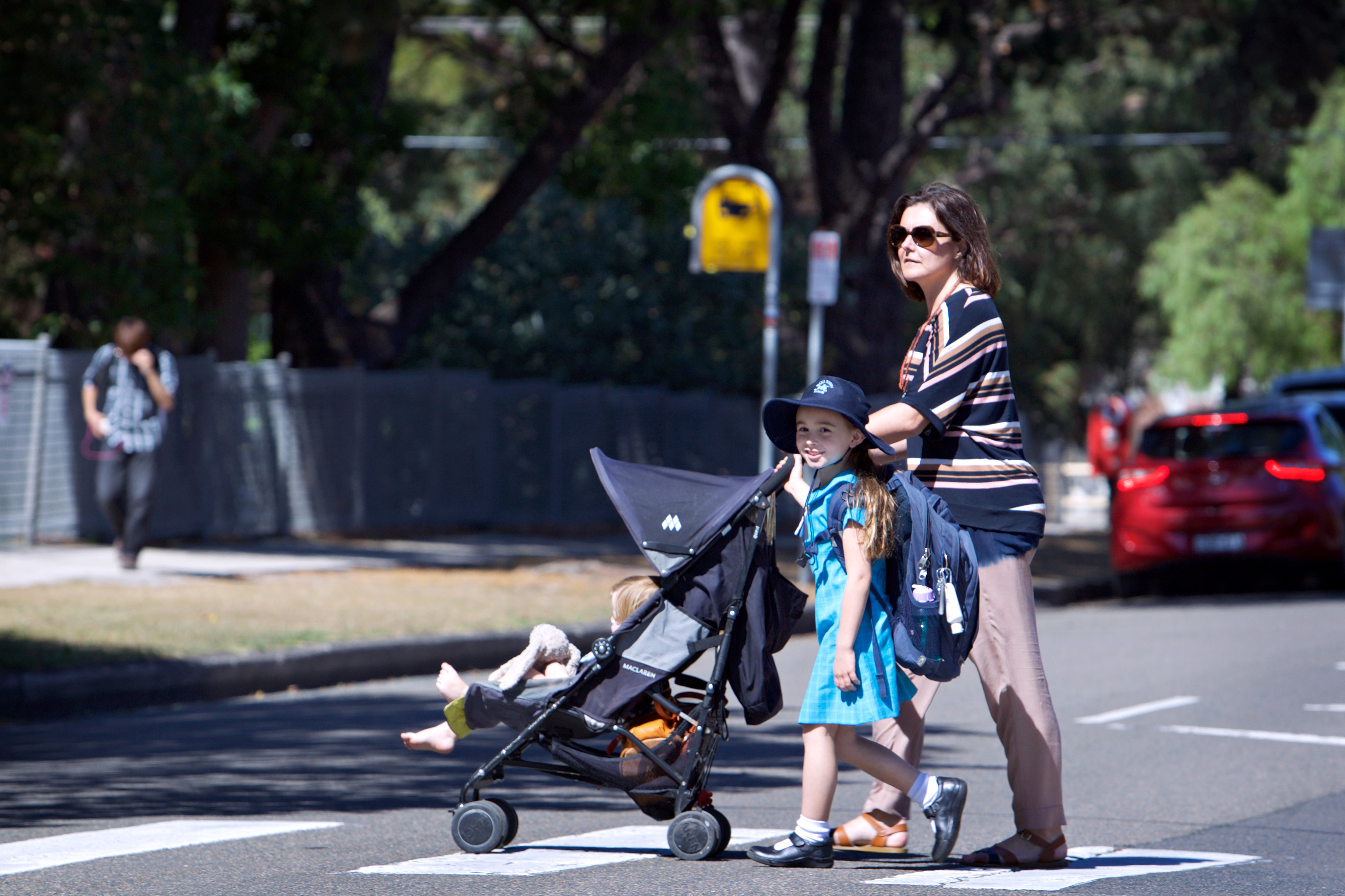 Mum and Daughter crossing a road